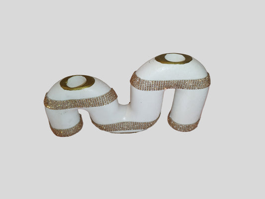 Two white containers with gold and silver decorative bands on a light gray background