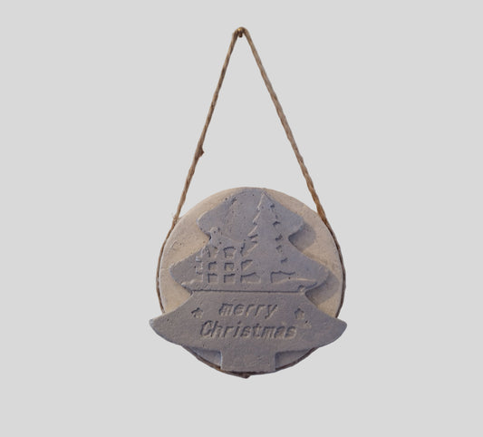 Round hanging Christmas decoration with a tree design and 'Merry Christmas' text on a light gray background.

