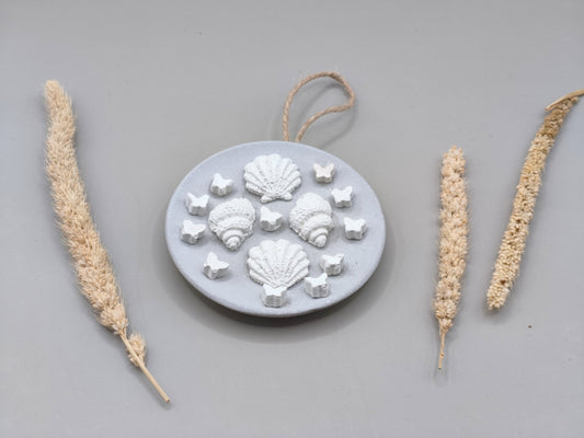 Στρογγυλό διακοσμητικό τοίχου με τσιμεντένια κοχύλια